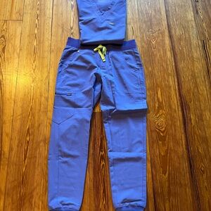 One pocket size medium tops and Jamora medium pants. 6 sets.